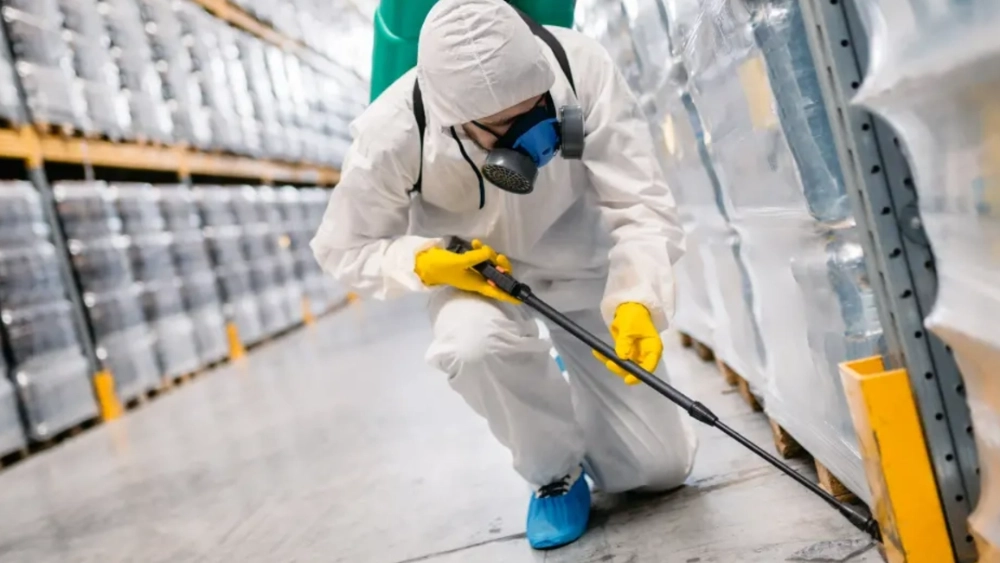 assuredenvironments-image-disinfection-technician-wearing-protective-suit