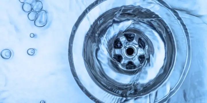 Water draining down a sink 